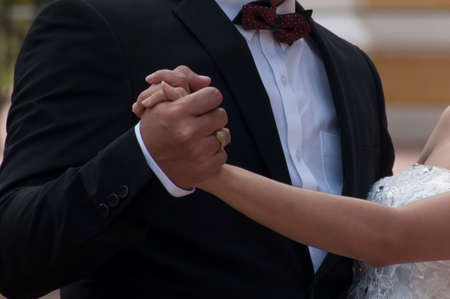 Man and woman holding handsの写真素材