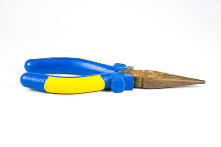 Old blue -handled pliers on white .の写真素材