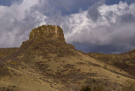 Castle Rock, South Table Mountain in Golden, Colorado with Dramatic Sky with Clouds
