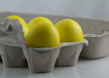 Yellow-Colored Eggs in Egg Carton