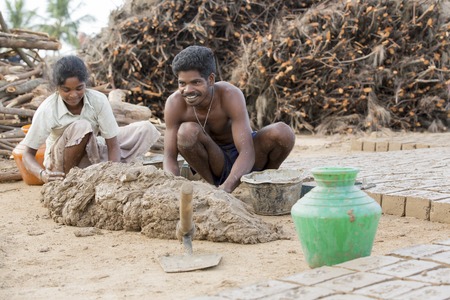 Asia India Tamil Nadu Sengal Soolai village. June 2014. All people of the village work 12 hours a day, 6 days per week, doing hand made bricks for buildings and house. They earn less than 50 dollars per month. Manufacturing of bricks from the beginning toのeditorial素材