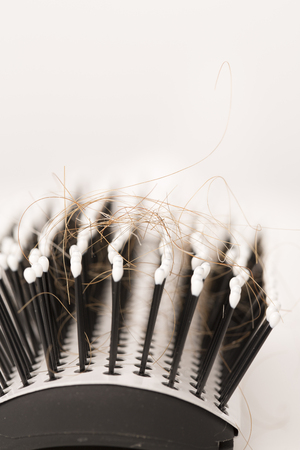 Close-up of  lost brown red hair, treatment homeopathy essential oils plant pillsの写真素材