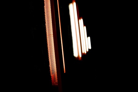 Neon tube light colored night disco black backgroundの写真素材