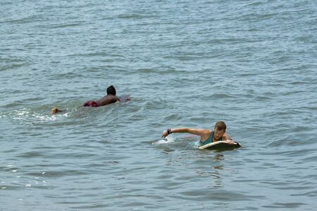 Man Body Boarder surfing on the waves Sea beach