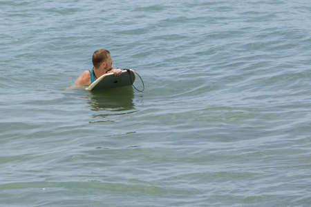 Man Body Boarder surfing on the waves Sea beach