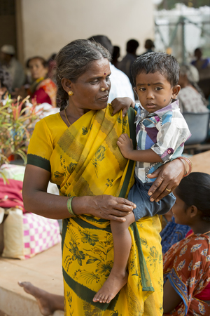 Documentary Editorial. Pondicherry Jipmer hospital, India - June 1 2014. Full documentary about patient and their family. While children are hospitalized, Families waiting eating outdoorのeditorial素材