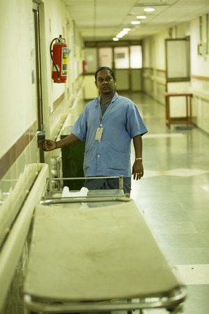 Documentary Editorial. Pondicherry Jipmer hospital, India - June 1 2014. Full documentary about patient and their family. While children are hospitalized, Families waiting eating outdoorのeditorial素材