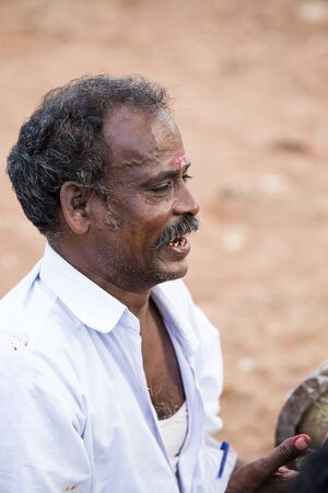 Pondicherry, Tamil Nadu,India - May 15, 2014 : each year in villages, people celebrate the temple fest, for the full day. They walk in groups, they launch paint on people, play music.のeditorial素材