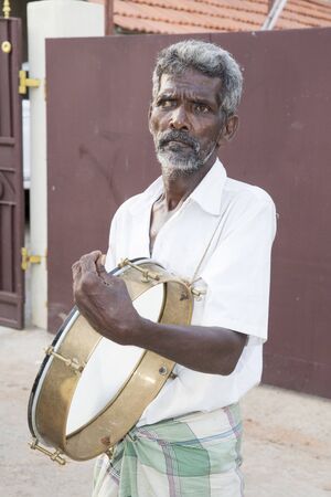 Pondicherry, Tamil Nadu,India - May 15, 2014 : each year in villages, people celebrate the temple fest, for the full day. They walk in groups, they launch paint on people, play music.のeditorial素材