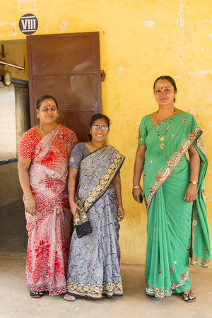 Pondichery, Tamil Nadu, India - March 03, 2014. In the school, teachers preparing the shooting photo of the students. Children very excited of this moment.のeditorial素材