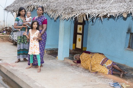 Illustrative image. Pondichery, Tamil Nadu, India. April 14, 2014. Child with mother in the street of villageのeditorial素材