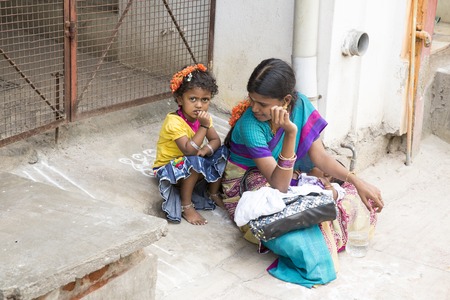 Illustrative image. Pondichery, Tamil Nadu, India. April 14, 2014. Child with mother in the street of villageのeditorial素材