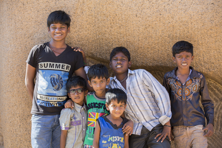 Illustrative image. Pondicherry, Tamil Nadu, India - February 25, 2014. Adolescents, young people in the street, eating shopping selling playingのeditorial素材