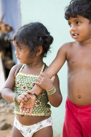 Illustrative image. Pondicherry, Tamil Nadu, India - Marsh 13, 2014. Poor children boys and girls in the street of small villagesのeditorial素材