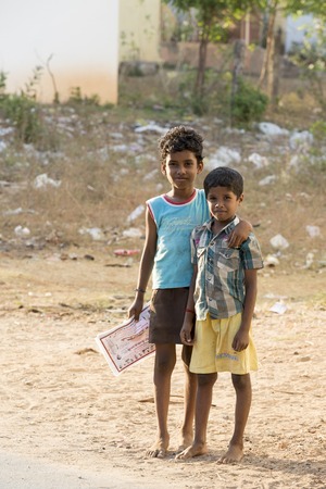 Illustrative image. Pondicherry, Tamil Nadu, India - Marsh 13, 2014. Poor children boys and girls in the street of small villagesのeditorial素材