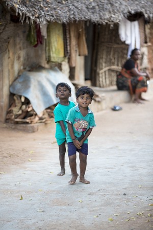 Illustrative image. Pondicherry, Tamil Nadu, India - Marsh 13, 2014. Poor children boys and girls in the street of small villagesのeditorial素材