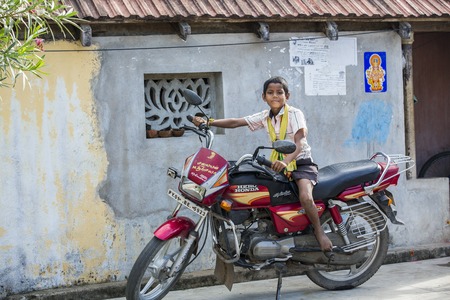 Illustrative image. Pondicherry, Tamil Nadu, India - Marsh 13, 2014. Poor children boys and girls in the street of small villagesのeditorial素材