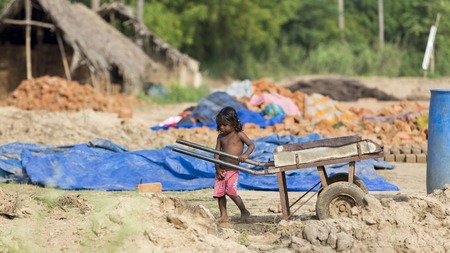 Illustrative image. Pondicherry, Tamil Nadu, India - Marsh 13, 2014. Poor children boys and girls in the street of small villagesのeditorial素材