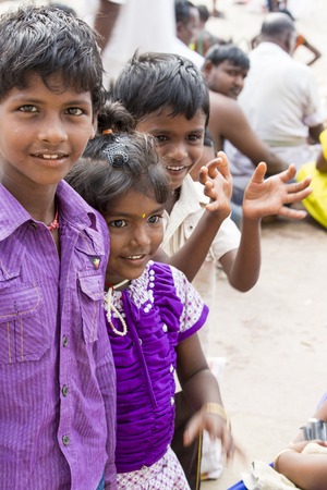 Illustrative image. Pondicherry, Tamil Nadu, India - Marsh 13, 2014. Poor children boys and girls in the street of small villagesのeditorial素材