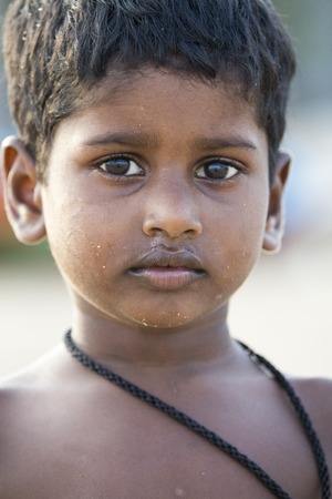 Illustrative image. Pondicherry, Tamil Nadu, India - April 21, 2014. Poor child with sad feeling, in the streetのeditorial素材