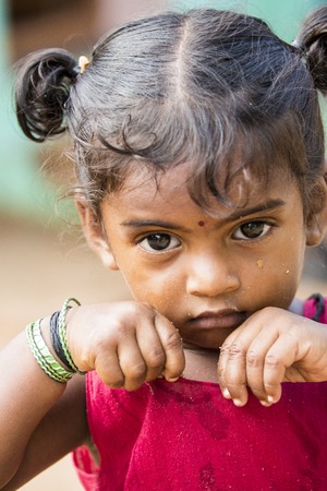 Illustrative image. Pondicherry, Tamil Nadu, India - April 21, 2014. Poor child with sad feeling, in the streetのeditorial素材