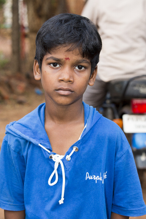 Illustrative image. Pondicherry, Tamil Nadu, India - April 21, 2014. Poor child with sad feeling, in the streetのeditorial素材