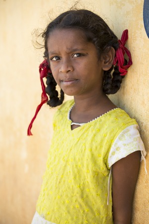 Illustrative image. Pondicherry, Tamil Nadu, India - April 21, 2014. Poor child with sad feeling, in the streetのeditorial素材