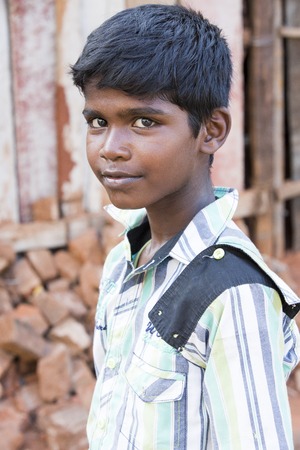 Illustrative image. Pondicherry, Tamil Nadu, India - Marsh 07, 2014. Poor child with smile feeling, in the streetのeditorial素材