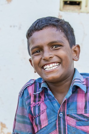 Illustrative image. Pondicherry, Tamil Nadu, India - Marsh 07, 2014. Poor child with smile feeling, in the streetのeditorial素材