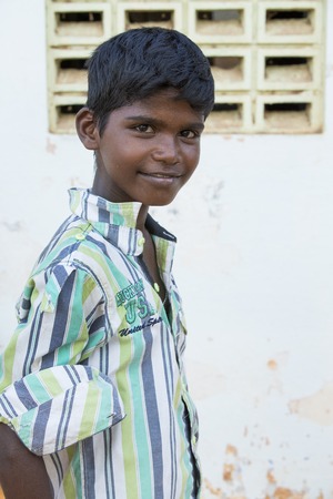 Illustrative image. Pondicherry, Tamil Nadu, India - Marsh 07, 2014. Poor child with smile feeling, in the streetのeditorial素材