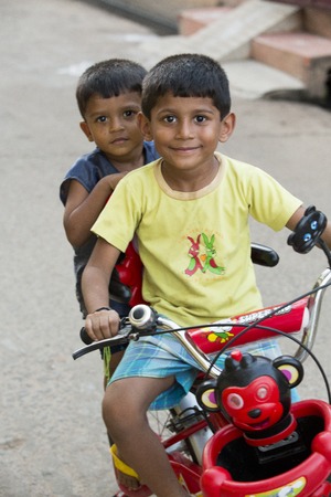 Illustrative image. Pondicherry, Tamil Nadu, India - Marsh 07, 2014. Poor child with smile feeling, in the streetのeditorial素材