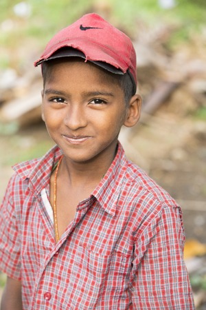 Illustrative image. Pondicherry, Tamil Nadu, India - Marsh 07, 2014. Poor child with smile feeling, in the streetのeditorial素材