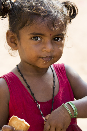 Illustrative image. Pondicherry, Tamil Nadu, India - Marsh 07, 2014. Poor child with smile feeling, in the streetのeditorial素材