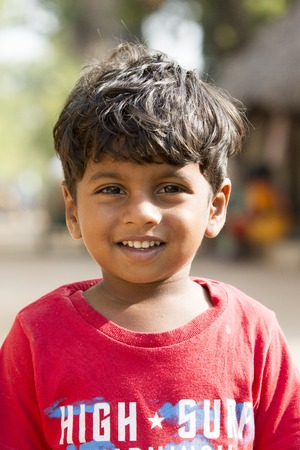 Illustrative image. Pondicherry, Tamil Nadu, India - Marsh 07, 2014. Poor child with smile feeling, in the streetのeditorial素材