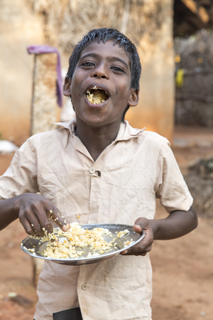 Illustrative image. Pondicherry, Tamil Nadu, India - Marsh 07, 2014. Poor child with smile feeling, in the streetのeditorial素材