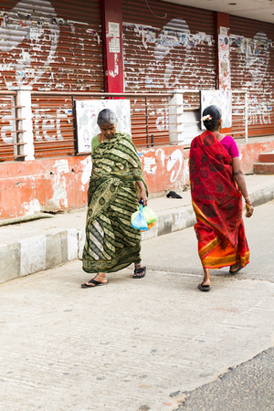 Illustrative image. Pondicherry, Tamil Nadu, India - Marsh 02, 2014. Indian colored house with people walking sittingのeditorial素材