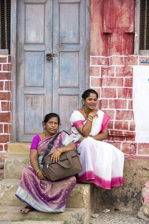 Illustrative image. Pondicherry, Tamil Nadu, India - Marsh 02, 2014. Indian colored house with people walking sittingのeditorial素材