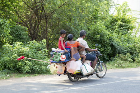 Illustrative image. Pondicherry, Tamil Nadu, India - Marsh 02, 2014. Motorbike, main way to move in the city for families, man, womanのeditorial素材