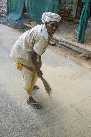 Illustrative image. Pondicherry, Tamil Nadu, India - July 03, 2014. Poor woman worker in small village, very hard work for little money roupiesのeditorial素材