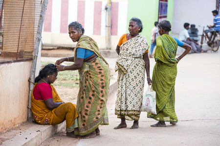 Illustrative image. Pondicherry, Tamil Nadu, India - April 21, 2014. Scenes of life in small poor villages, way of life, poverty for many woman, man, childrenのeditorial素材