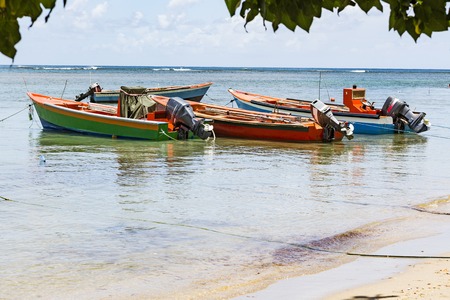 Colored small boats on Antilles sea, with blue sea.の写真素材