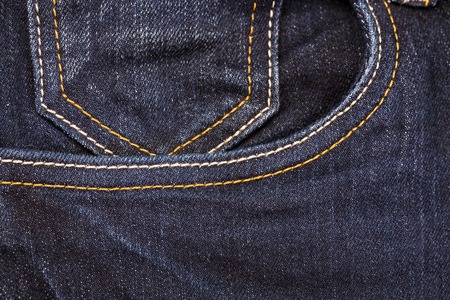 Blue denim Jeans pocket close-up background and textured