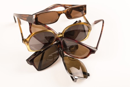 Cluster, pile of old sun glasses on with table, ready to recycleの写真素材