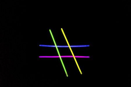 Glow sticks neon light fluorescent on back background. variation of different colored chem lightsの写真素材