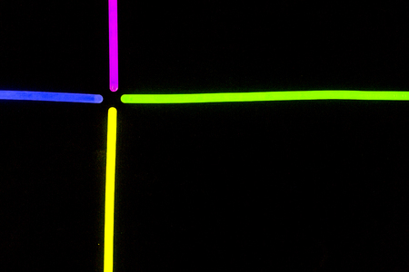 Glow sticks neon light fluorescent on back background. variation of different colored chem lightsの写真素材