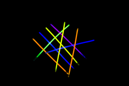 Glow sticks neon light fluorescent on back background. variation of different colored chem lights