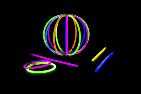 Ball, bracvelet, Glow sticks neon light fluorescent on back background. variation of different...
