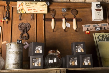 Valognes, Normandy, France - February 06, 2014. Traditional typical delicatessen shop in Normandy. Shop of jams, chutney, alcohol, biscuits, pasta, beer, milk jam and retro products for decoration In wooden boxesのeditorial素材