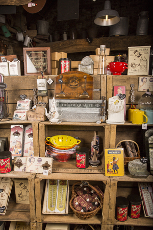 Valognes, Normandy, France - February 06, 2014. Traditional typical delicatessen shop in Normandy. Shop of jams, chutney, alcohol, biscuits, pasta, beer, milk jam and retro products for decoration In wooden boxesのeditorial素材