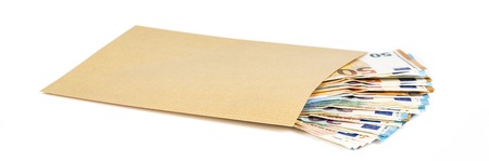 Brown envelope full of euro banknotes bills onwhite background. Concept of corruption and briberyの写真素材